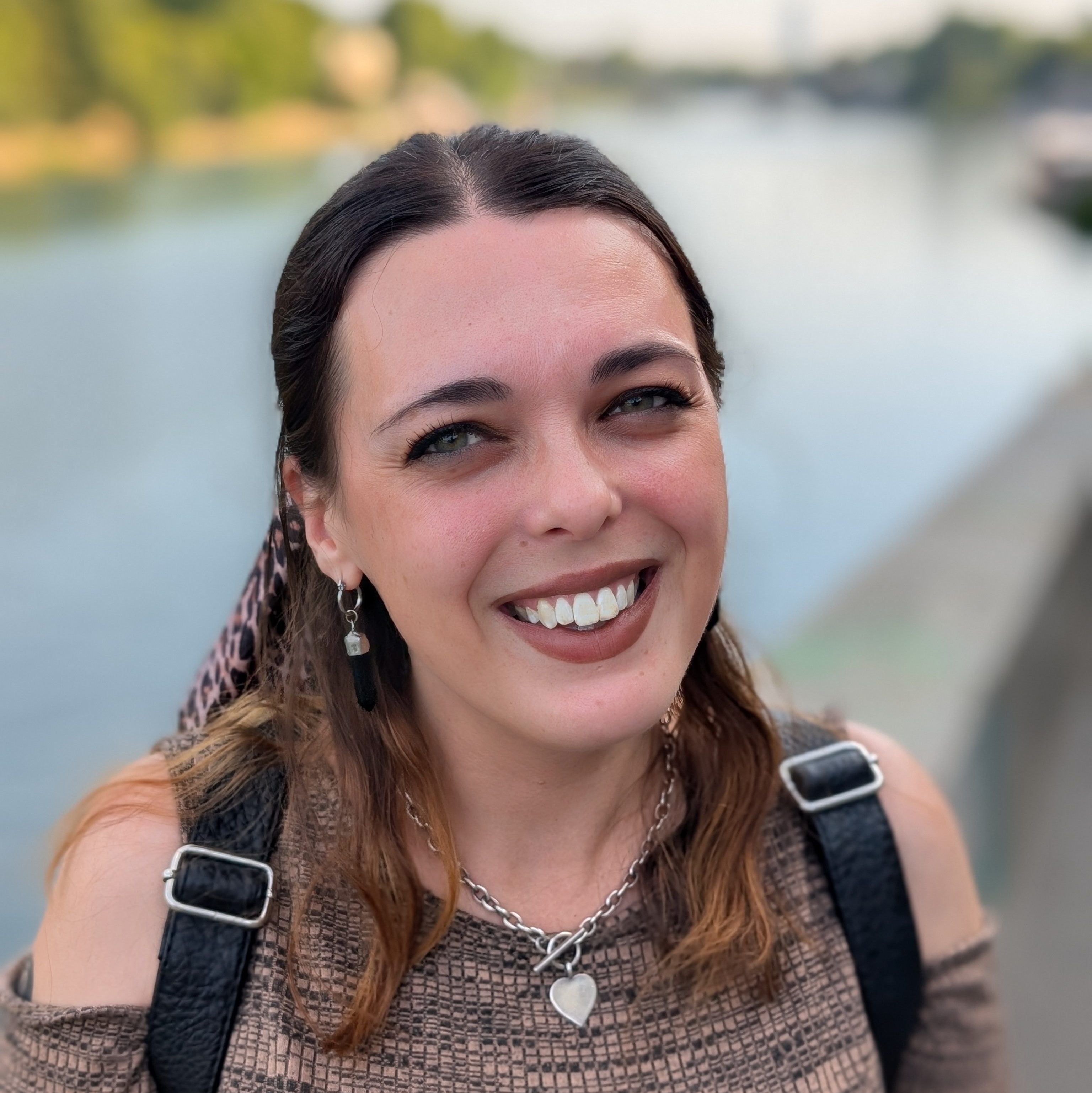Headshot of Rachel, a white brunette woman in her 30s